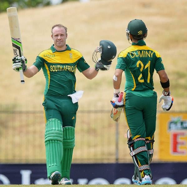 South African captain AB de Villiers (L) celebrates reaching a century (100 runs) as Jean-Paul Duminy looks on during the third and final One Day International (ODI) cricket match between South Africa and Sri Lanka at the Mahinda Rajapaksa International Cricket Stadium in Hambantota on July 12, 2014. 