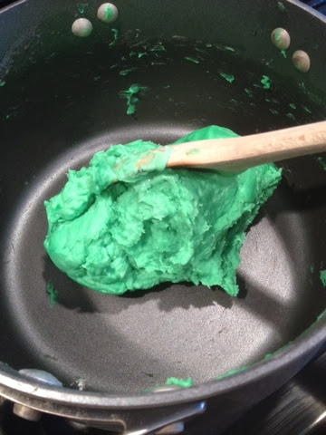 green homemade play dough in pot