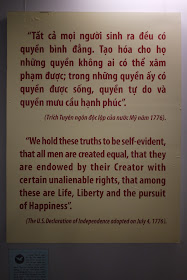 Poster with the English text, "'We hold these truths to be self-evident, that all men are created equal, that they are endowed by their Creator with certain unalienable rights, that among these are Life, Liberty and the pursuit of Happiness.' (The U.S. Declaration of Independence adopted on July 4, 1776).