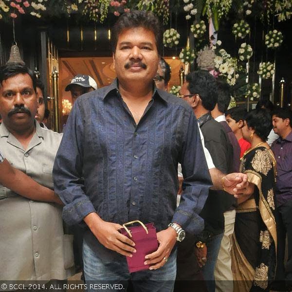 Shankar gets clicked during the wedding reception party of T Rajendar's daughter Elakkiya with Abhilash, held at The Leela Palace in Chennai.