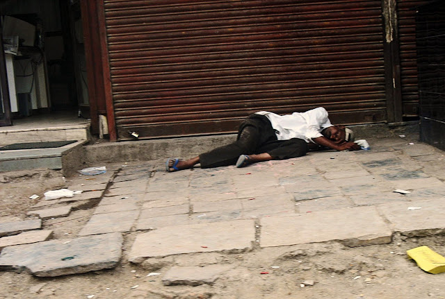 man lying on pavement