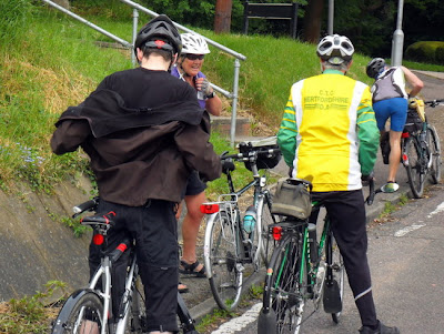 Cyclists shedding layers