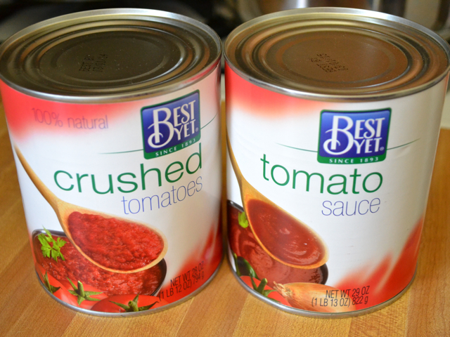 A can of crushed tomatoes and a can of tomato sauce 