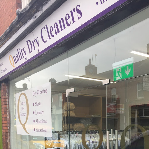 Quality Dry Cleaners logo