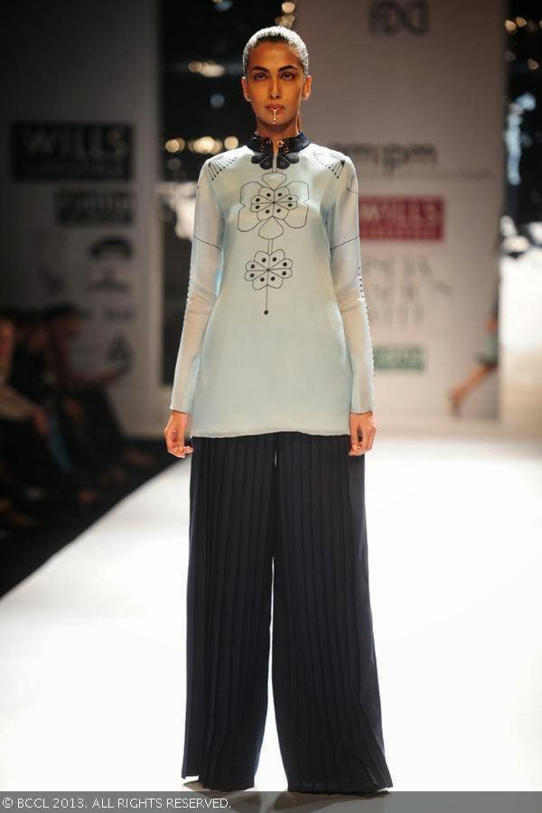 Sanea Sheikh showcases a creation by fashion designers Ankur Modi and Priyanka Modi on Day 2 of Wills Lifestyle India Fashion Week (WIFW) Spring/Summer 2014, held in Delhi.