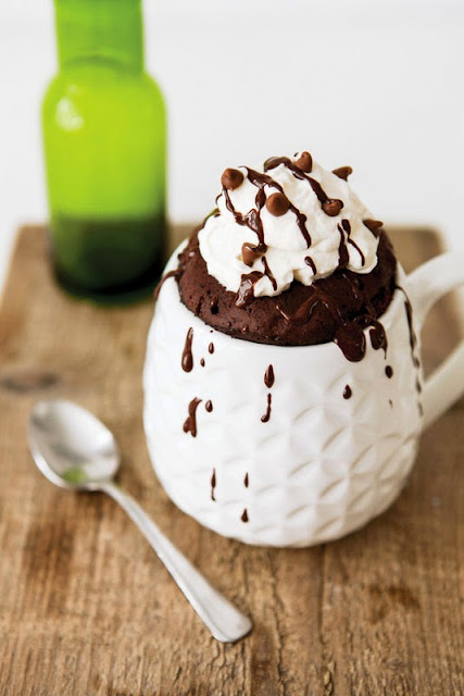 photo of a chocolate mug cake topped with whipped cream