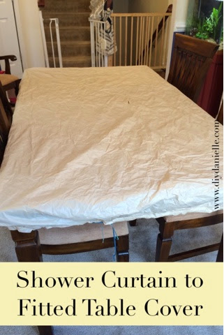 Upcycling a shower curtain to use as a fitted table cover to protect your table from children.