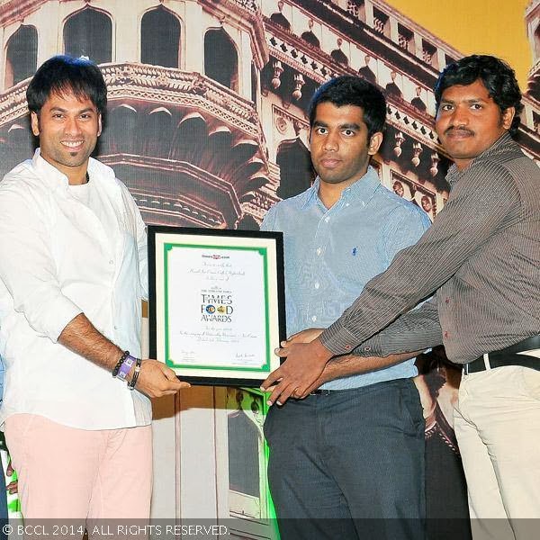 Omkar presents (Noteworthy Newcomer) Ice Cream award to the team of Olive Hazzel Ice Cream during the Times Food Guide & Nightlife awards 2014, held at HICC, Madhapur in Hyderabad.