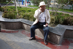 man talking on mobile phone in Xining, Qinghai, China