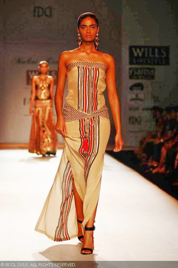Archana walks the ramp for fashion designer Malini Ramani on Day 1 of the Wills Lifestyle India Fashion Week (WIFW) Spring/Summer 2014, held in Delhi.
