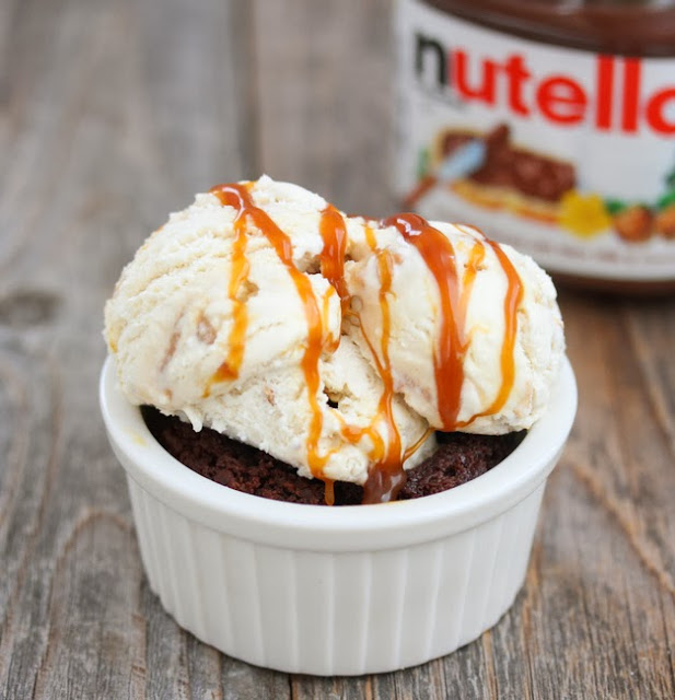 photo of a nutella brownie in a ramekin topped with ice cream