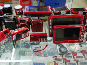 mobile audio and video players and USB flash drives for sale at a market in Hengyang, China