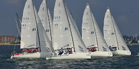 J/70s sailing off starting line