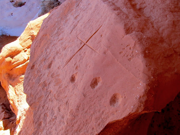 Chiseled circles and an incised cross