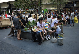 people sitting down at Dongmen shopping area in Shenzhen, China
