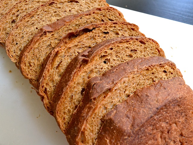 Close up of sliced oatmeal molasses bread
