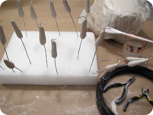 1. Start by preparing a bunch of 16 gauge hard wire stems about 7 inches long with one bend end. Roll clay in a quarter size ball and insert wire through the center. 1. Start by preparing a bunch of 16 gauge hard wire stems about 7 inches long with one bend end. Roll clay in a quarter size ball and insert wire through the center.