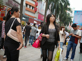 woman holding a red purse in Shenzhen