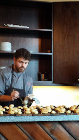 Tesoaria Portland Tasting Room January brunch: Chef Max prepares to ladle country gravy on the buttermilk biscuits