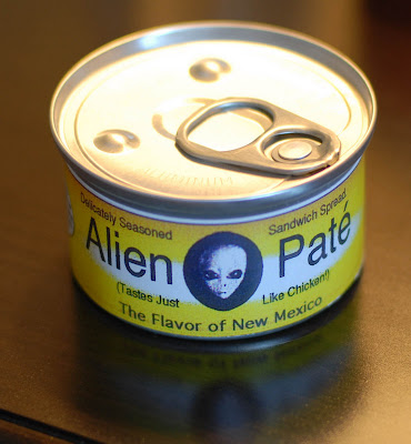 A close up of a can of alien pate