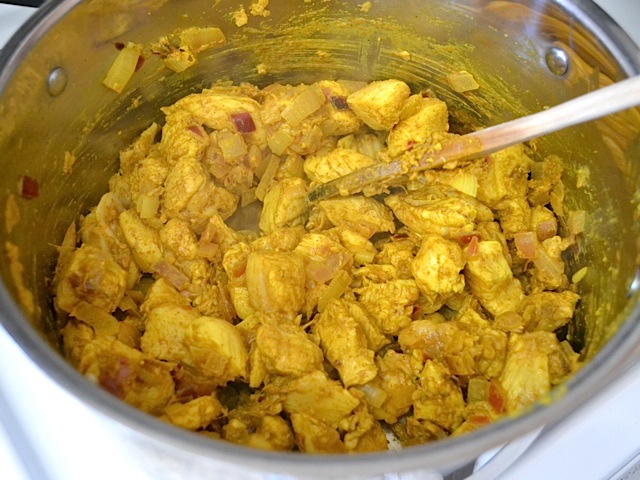 chicken and other ingredients cooked in pot 