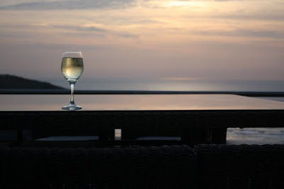 A glass of wine at sunset in Cornwall in the UK