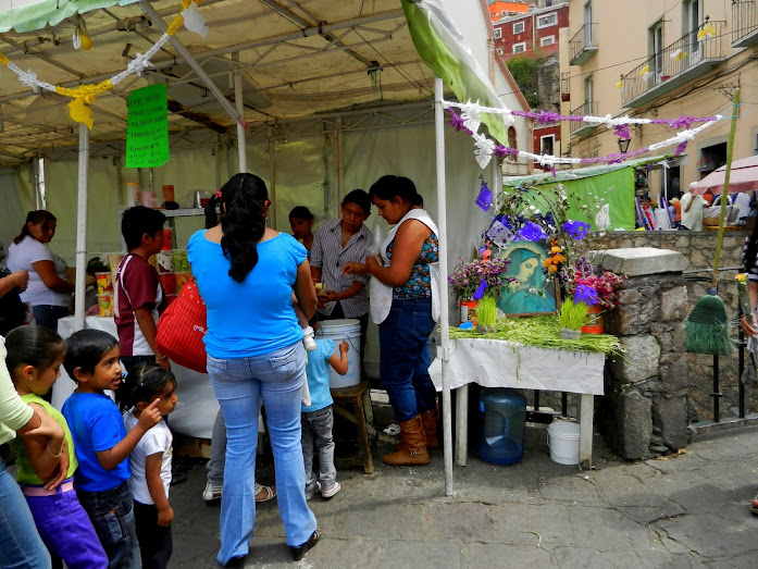 Altar and drinks lineup at the roadside food stand
