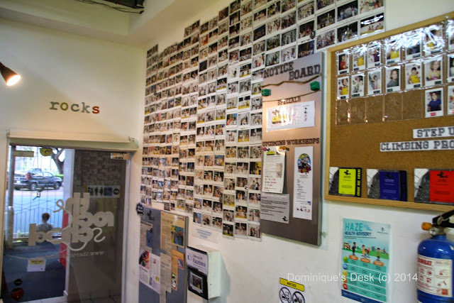 The inside wall plastered with photos of participants. 