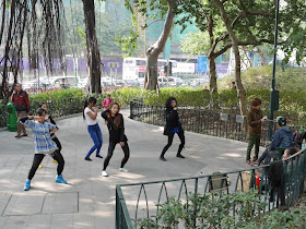 five women in the middle of a dance routine at the King George V Memorial Park in Kowloon, Hong Kong