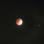 The Blood Moon with the star Spica to the right