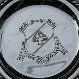The presidential crest impressed on a silver plated plate.