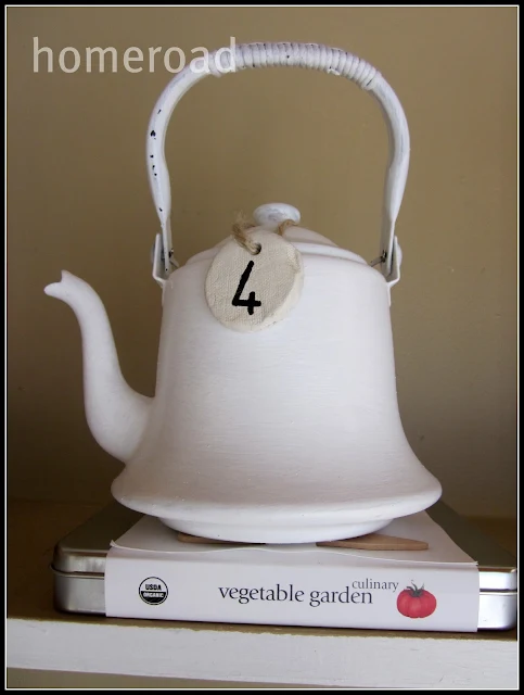clay tag on white teapot