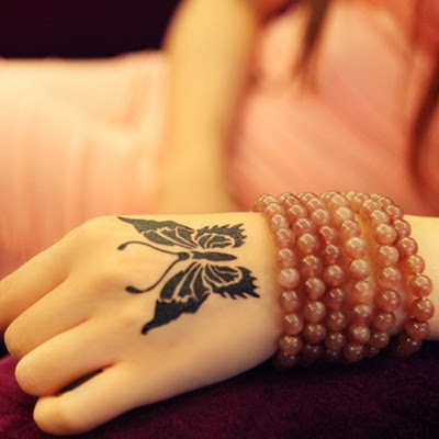 butterfly tattoo on hand