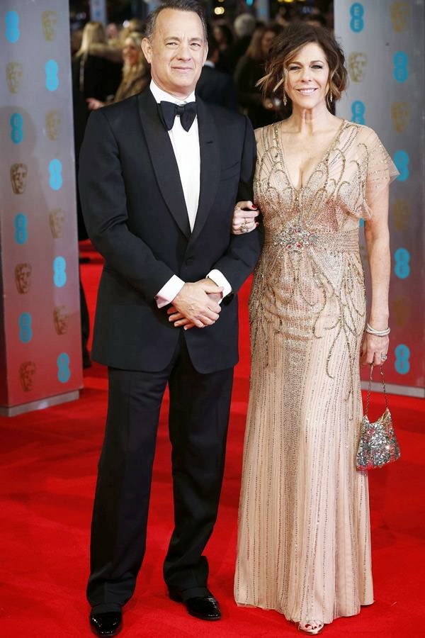 US actor Tom Hanks (L) and his wife Rita Wilson arrive on the red carpet for the BAFTA British Academy Film Awards at the Royal Opera House in London on February 16, 2014.