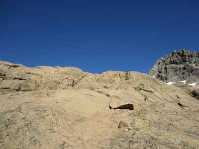 Sara heading up the slabby rocks as we make our way towards the route