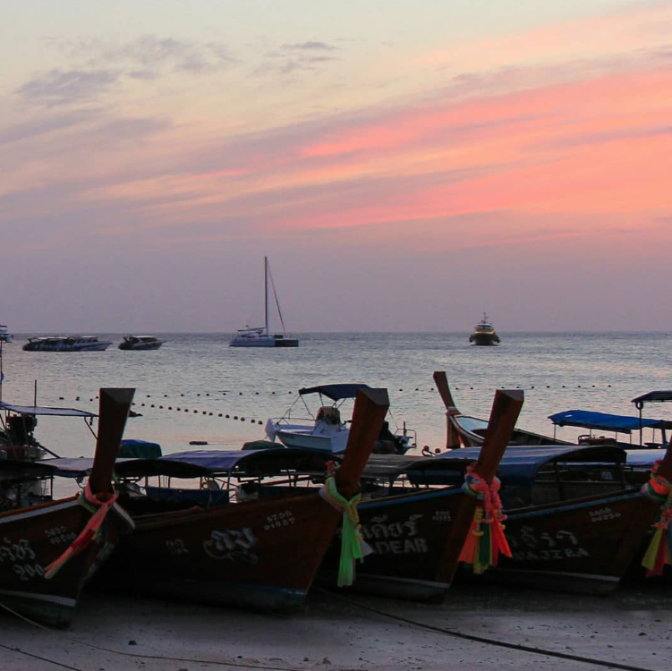 longtail boats on a thai beach