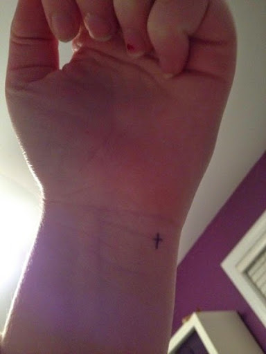 tiny cross tattoo on wrist girl
