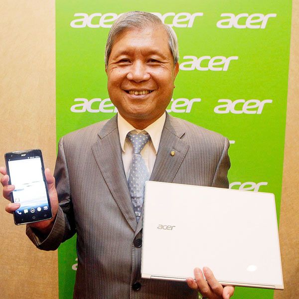 Acer's Chairman JT Wang poses for cameras during an interview before the opening of the Computex exhibition at the Taipei International Convention Center in Taipei on June 3, 2013.