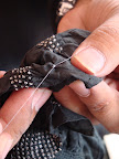 The fabric is completely tied and then dyed