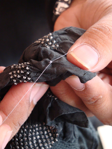 The fabric is completely tied and then dyed
