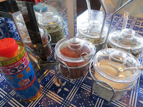Sen Yai Condiments Tray red chili powder, chilies in vinegar, sugar, chilies in fish sauce Thai food Andy Ricker Sen Yai noodle restaurant