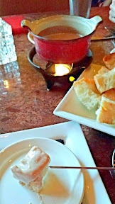 Urban Fondue menu, Ruby Port Cheese Fondue with white cheddar, Swiss and Gruyere cheeses, finished with caramelized sweet onions and port wine