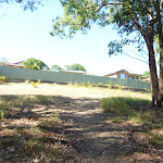 Metal fence and houses at the edge of the Green Point Reserve (403474)