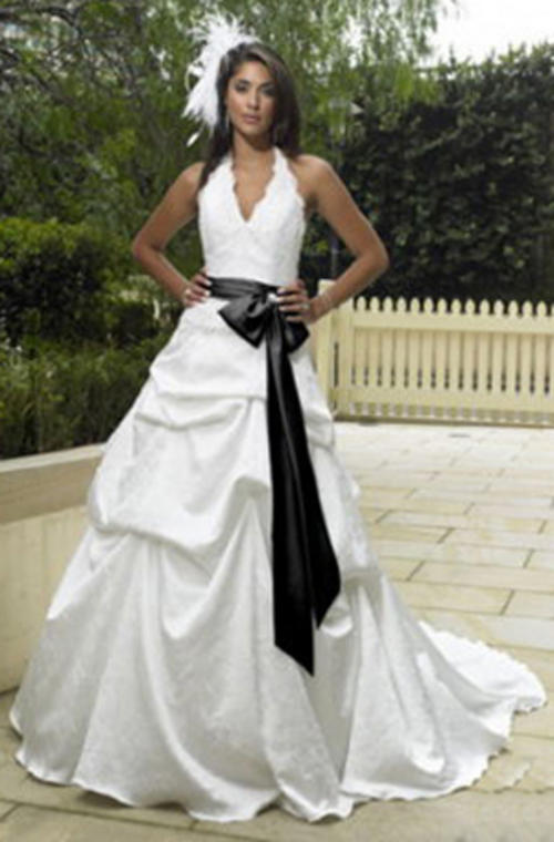 bride with black sash on wedding dress