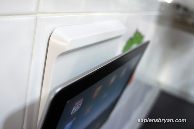 The iPad will stick tightly to the wall mount using magnets