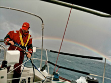 J/160 sailing offshore to US Virgin Islands- rainbow over ocean