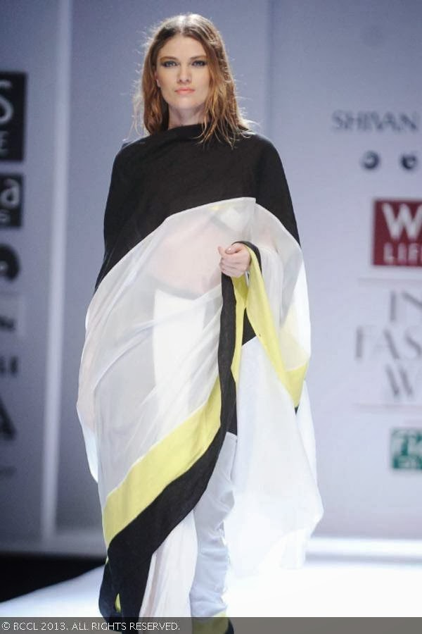 Kristina walks the ramp for fashion designers Shivan & Narresh on Day 2 of the Wills Lifestyle India Fashion Week (WIFW) Spring/Summer 2014, held in Delhi.