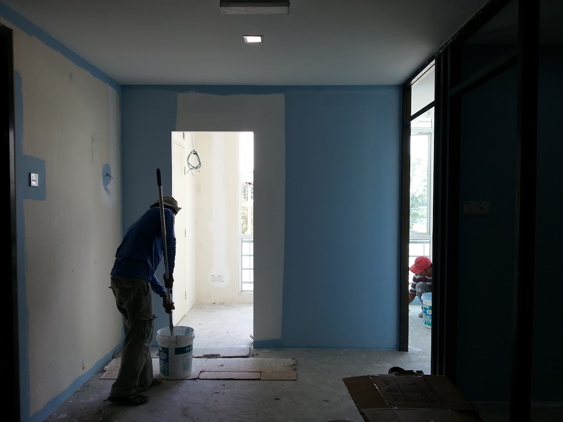 painting wall with emulsion paint