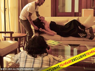 A crew member helps Tabu while she poses for an exclusive photoshoot for Filmfare.