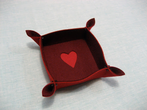 To make a design in the center of your catch-all, simply cut it from the center square with a craft knife before ironing it down. To make a design in the center of your catch-all, simply cut it from the center square with a craft knife before ironing it down.